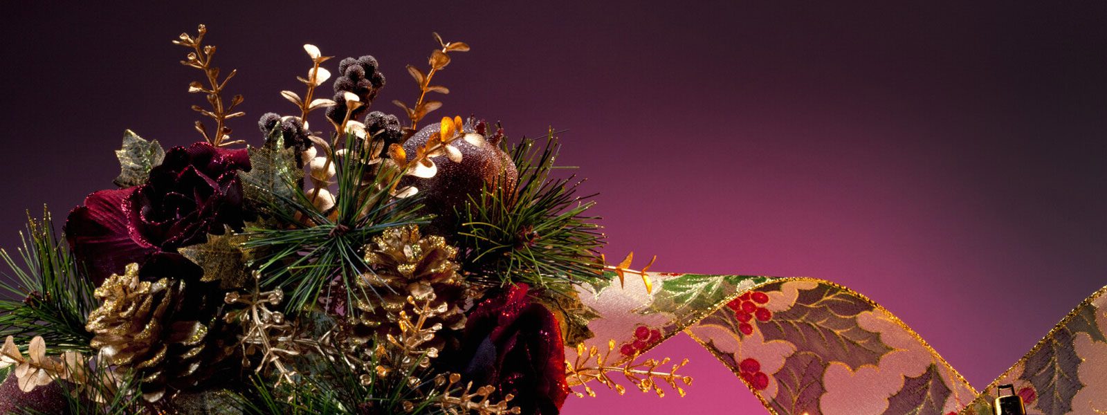 Christmas Floral Arrangement With Purple Candles