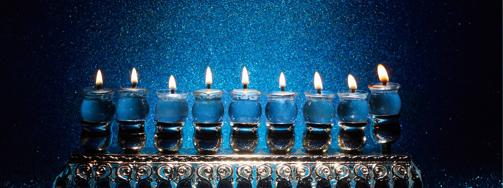 Hanukkah Menorah Against Blue Background