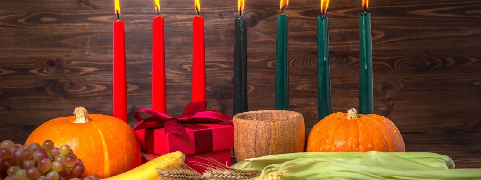 Kwanzaa Display Against Dark Wood Background
